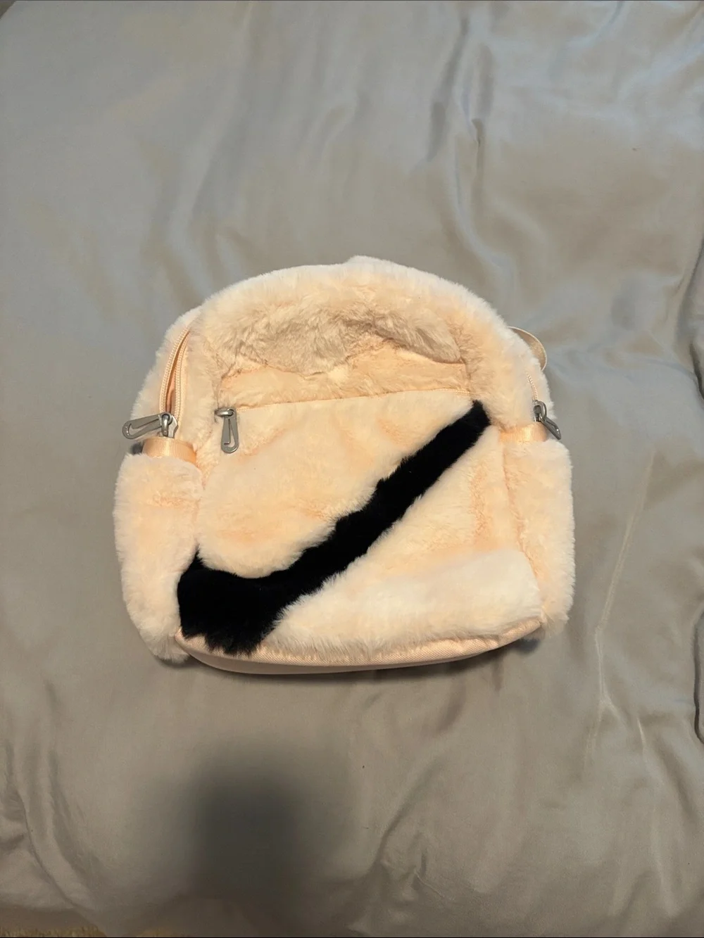 Nike Plush Faux-Fur Mini Backpack in Cream with Black Swoosh